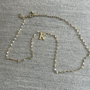 Pale gold K letter necklace